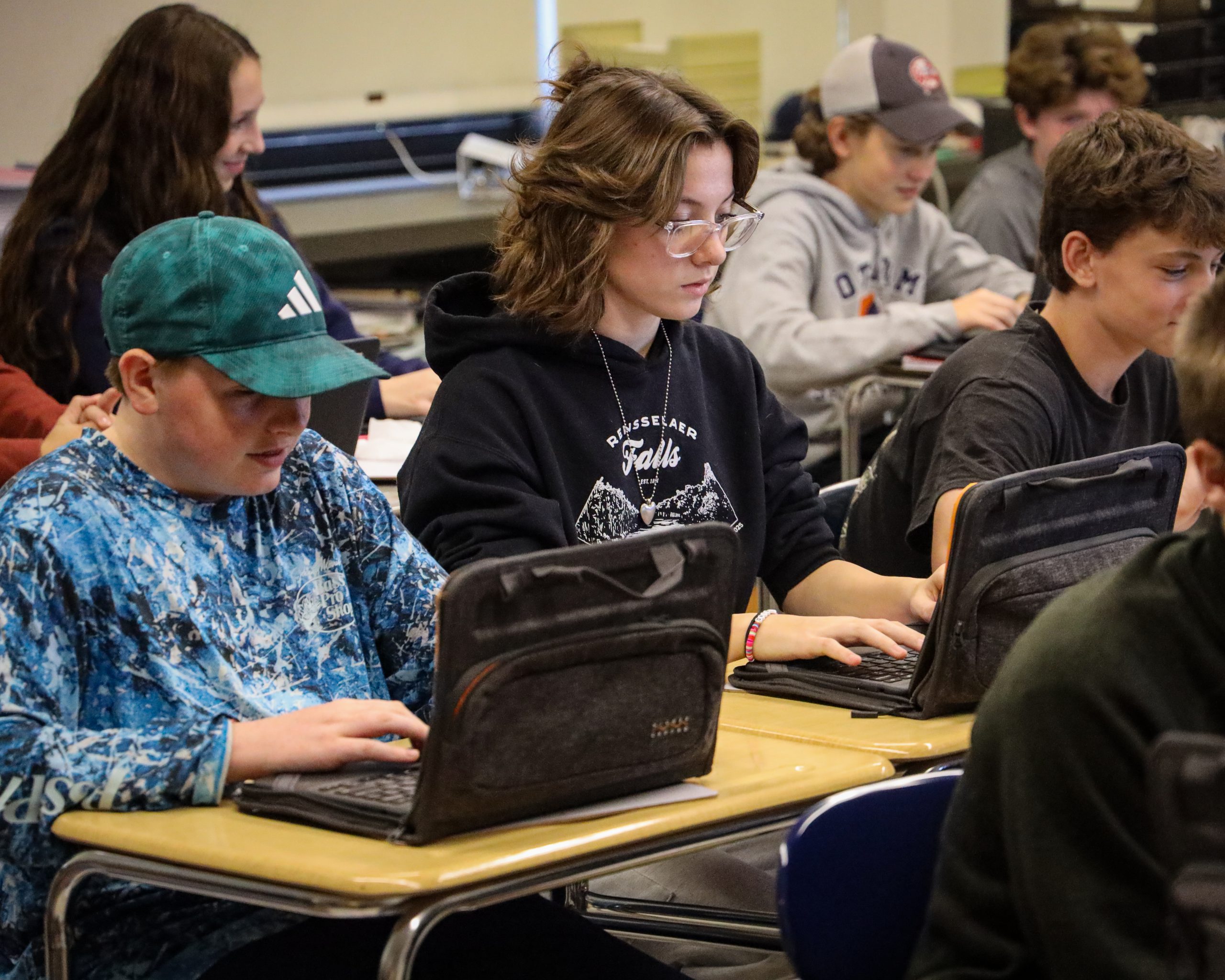 Students work on assignment on their Chromebooks.