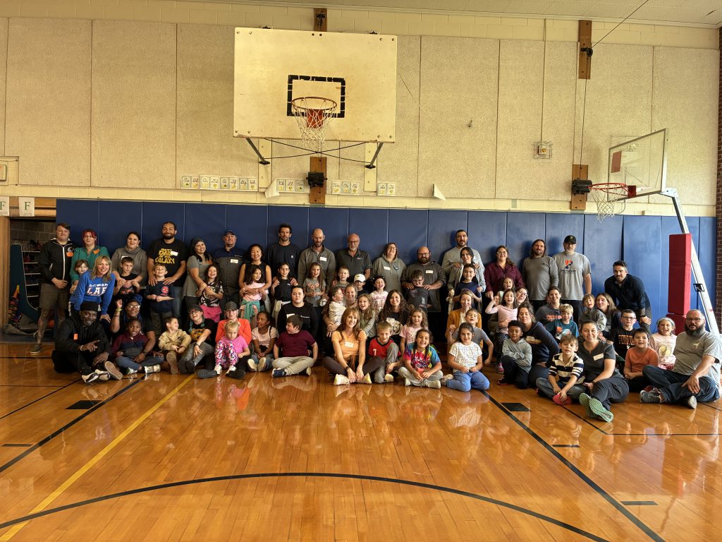 Families join their students in physical education class for an annual tradition.