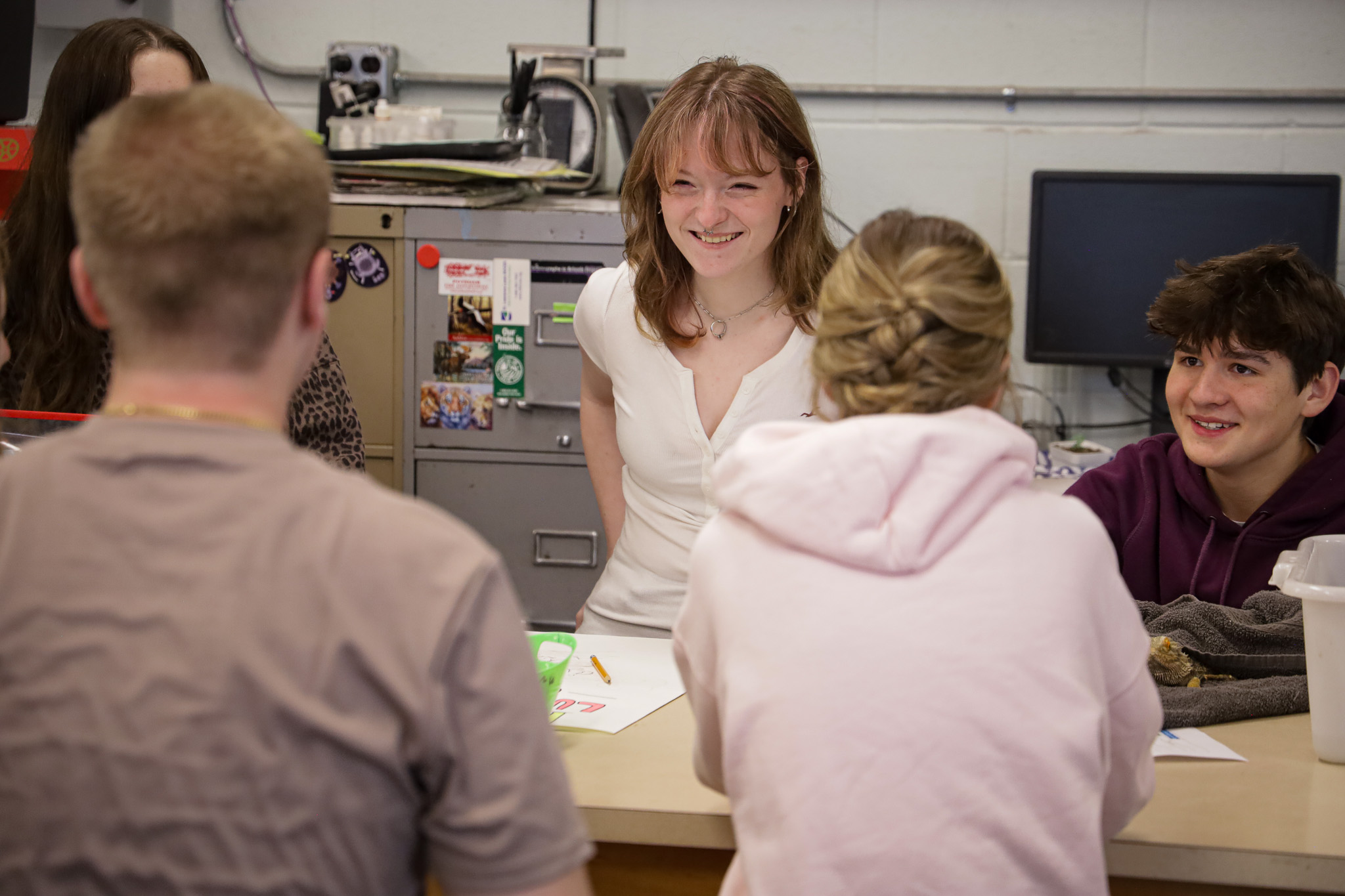 High school students smile candidly during a class