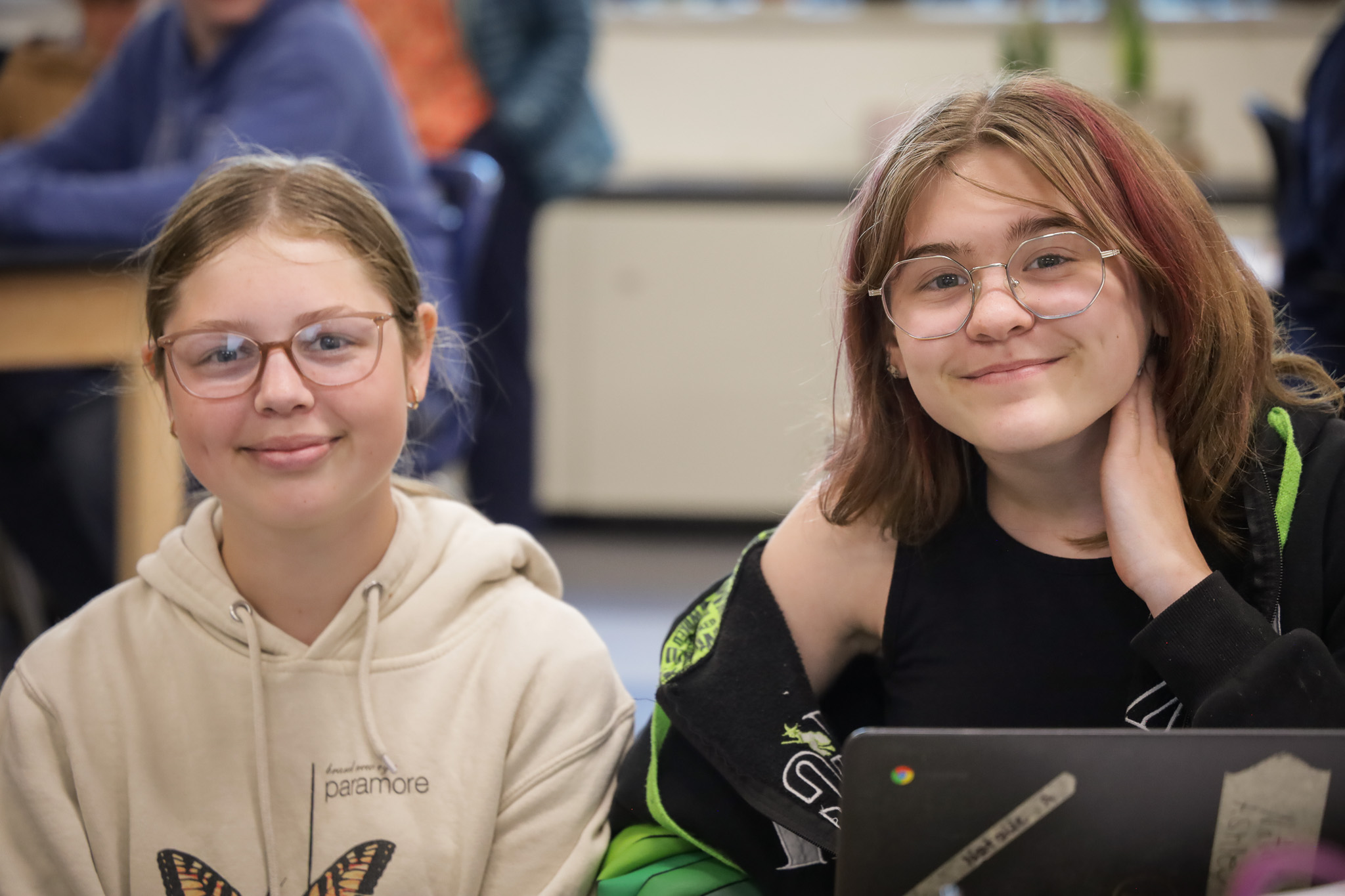 Two middle school girls smile for camera
